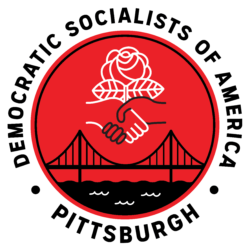 A red circle. At the top is white rose with white leaves. In front of the rose are a white hand and a black hand formed in a handshake. In the middle/bottom of the red circle is a black suspension bridge over black water with white squiggly waves. A white border with black text is around the outside that says Democratic Socialists of America - Pittsburgh.